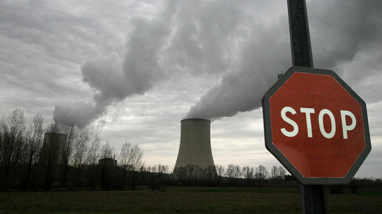 Stop sign in front of a nuclear power plant